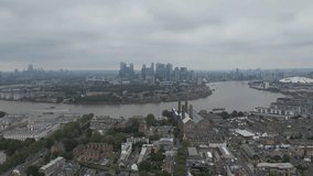 Aerial video footage of the Thames River and London riverside.