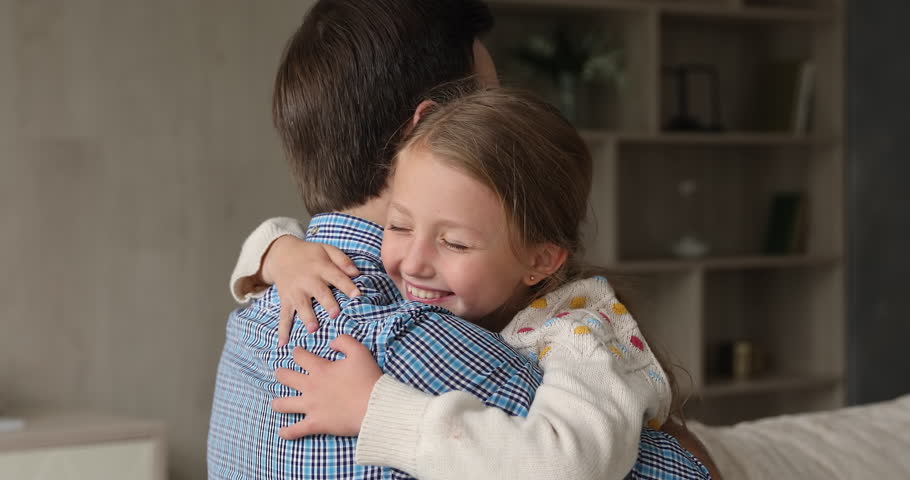 Together again with daddy. Happy kid girl hug beloved father hold on tight to parent meet after being long time apart. Loving preteen adopted daughter embrace neck of caring foster dad at adoption day Royalty-Free Stock Footage #1110482535