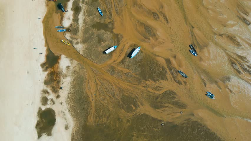 Aerial view of small boats stranded in the nearly dry bed of the Tapajos river in Alter do Chao, Santarem, Brazil, during the amazonian drought in the second half of 2023 Royalty-Free Stock Footage #1110487225