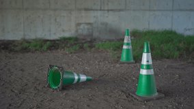 three colored cones placed in the shade