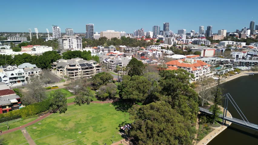 Aerial view of Mardalup Park and Claise Brook in Perth City, Australia. Drone Video of Mardalup Park with buildings in the background during a sunny clear sky day 