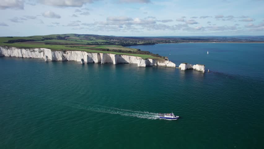 Aerial Shot of Passenger Tour Boat Ferry around Old Harry Rocks, Jurassic Coast, Great Britain.