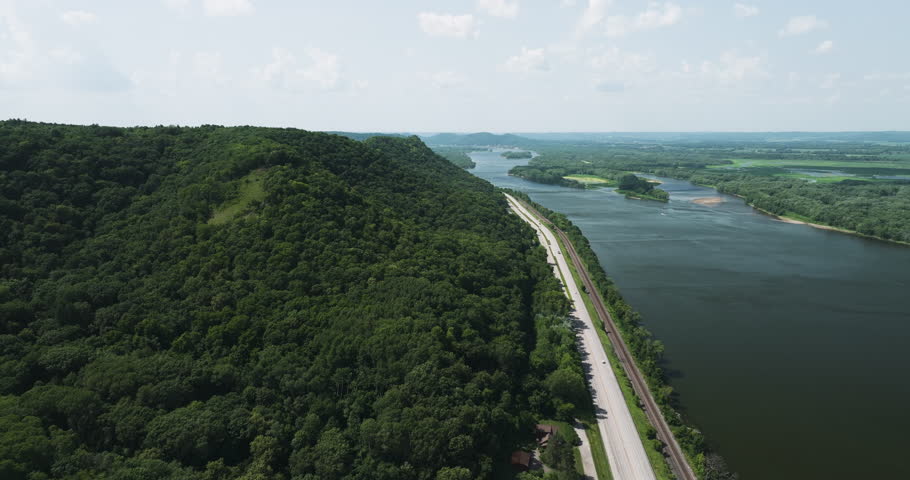 Aerial View Of A Dense Forest And Coastal Road In Great River Bluffs State Park In Minnesota, United States.