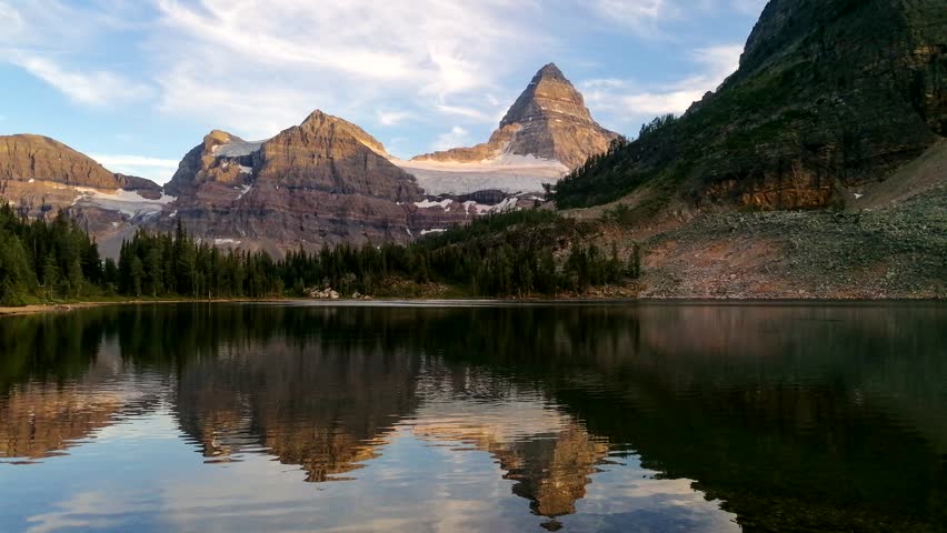 4K Time Lapse of Sunset at Sunburst Lake, Reflection of Mount Assiniboine, Assiniboine Provincial Park in British Columbia, Border of Banff National Park, Canada