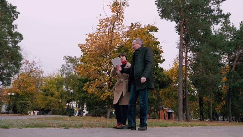 Man and woman work for same company discussing various work related matters