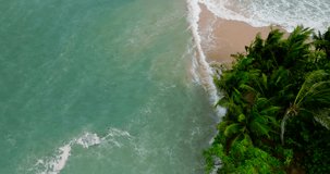 Sea beach Top down Camera aerial view Seawater wave rolling come in sand beach at sunset time Nature video and travel concepts High quality footage recorded by cinema camera DCI 4K ProRes 422