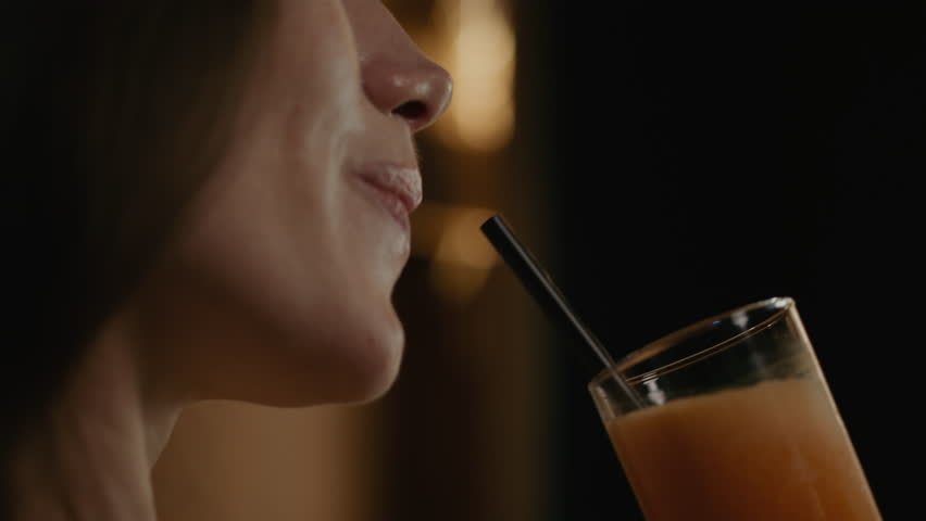 Close Up Of Woman Drinking Through Straw. Royalty-Free Stock Footage #1110523435