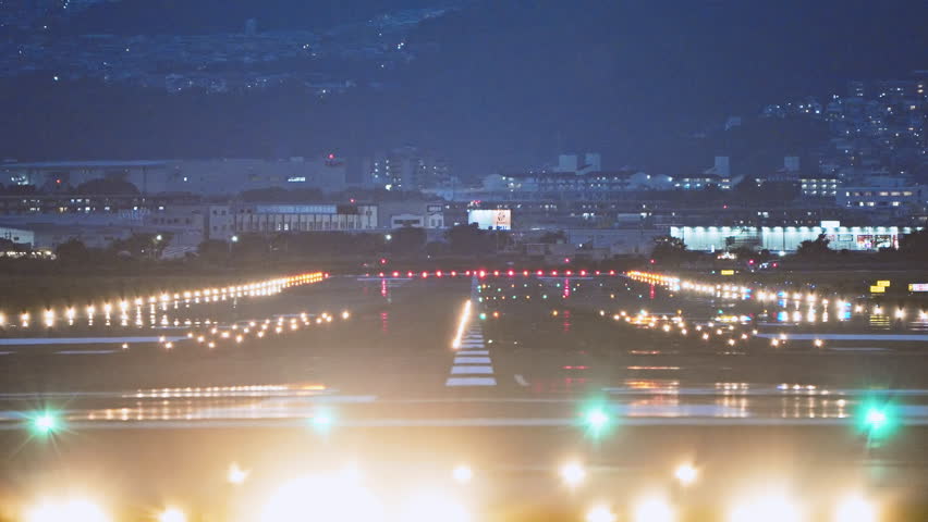 Large commercial airplane landing on runway, passenger landed safely at night. Journey abroad tourism, oversea travel, flight transit, air travel transport, airline business, transportation industry Royalty-Free Stock Footage #1110525265