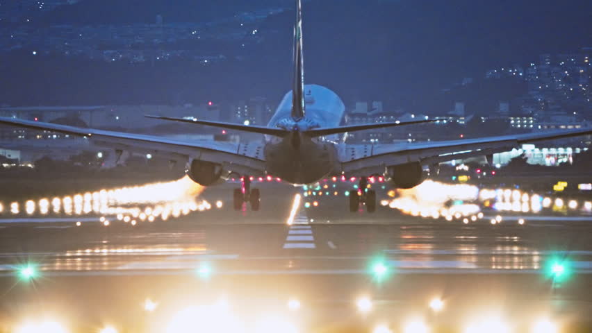 Large commercial airplane landing on runway, passenger landed safely at night. Journey abroad tourism, oversea travel, flight transit, air travel transport, airline business, transportation industry | Shutterstock HD Video #1110525265