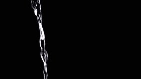 Transparent Pouring Stream of Clean Water Flowing on Isolated Black Background. One water jet glistens and shines in the light. Swirl. Slow movement of falling water. Drink clean water. Tea, coffee. - Powered by Shutterstock - Get 15% off with code: PIKWIZARD15