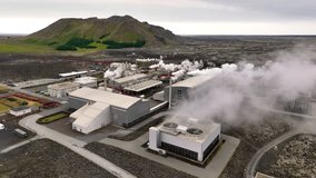 4K aerial video of geothermal energy plant, pipes and smoke chimneys. Iceland