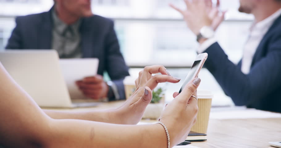 Business woman, phone and hands in meeting for communication, networking or social media at office. Closeup of female person or employee with mobile smartphone for online search or networking at work