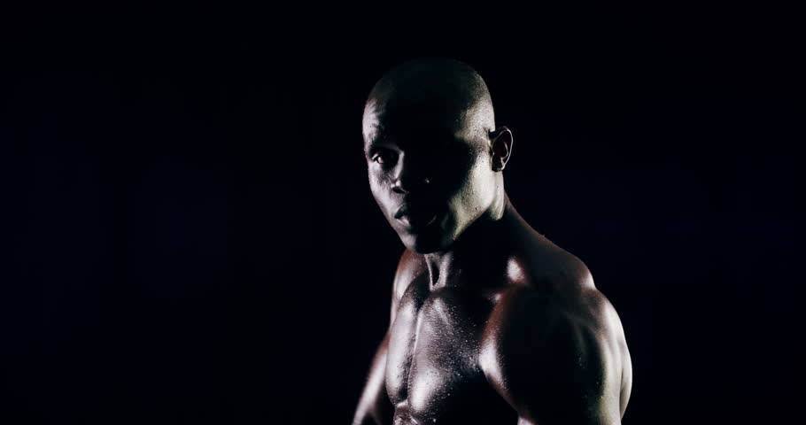 Face of athlete, sports or African boxer boxing for fitness, punch power or wellness on black background. Come here, fighter or strong man in studio for workout, combat training or fighting exercise Royalty-Free Stock Footage #1110537335