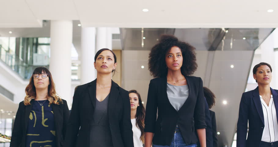 Business people, mindset and walking in office building with solidarity, mission or goal focus. Serious, confidence and group of people in a lobby for team collaboration, growth and purpose together Royalty-Free Stock Footage #1110538791