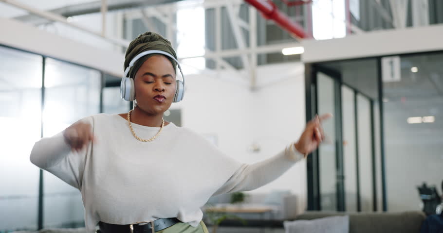 Dance, headphones and business woman dancing with a happy, freedom and smile in a office. Technology, happiness and excited employee with music for funny, comic and crazy experience in a workplace Royalty-Free Stock Footage #1110540537
