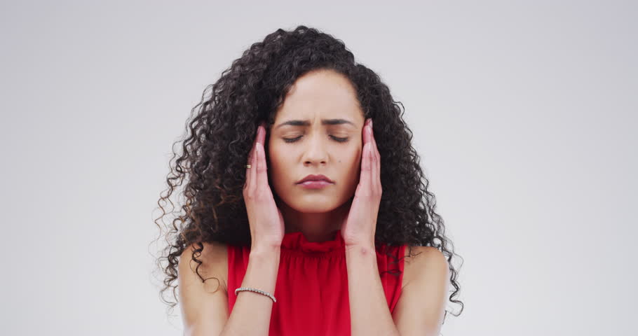 Headache, studio face and woman overwhelmed with mental health crisis, disaster or sad emotional burnout. Tension migraine, pressure and frustrated person massage temple isolated on white background