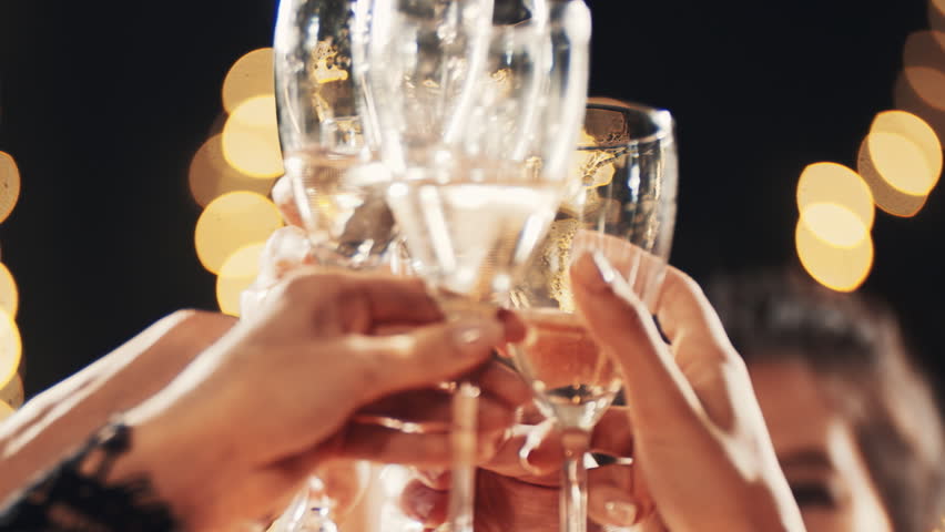Stylish friends close up celebrating at glamorous merry Christmas new year birthday party making toast drinking champagne at formal social gathering enjoying evening celebration at Eve winter night. Royalty-Free Stock Footage #1110544635