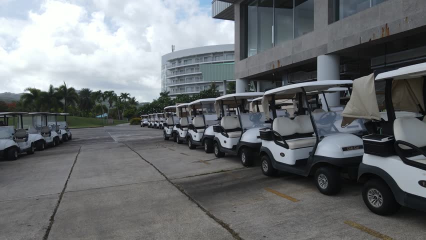 Golf Carts Waiting to Reach the Green