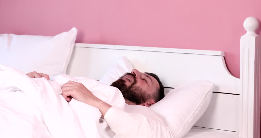 Bearded man snoring loudly in his bed at home.  Royalty-Free Stock Footage #1110559387