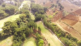 Aerial Landscape Video Golf Courses in Bandung City - Indonesia. Drone Footage of Golf course. 4k Video of Golf Course on mountain top