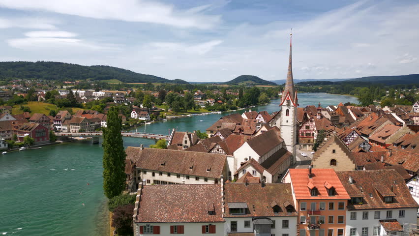 Aerial view of Stein am Rhein, a small town in northeastern Switzerland. It is known for its well-preserved medieval half-timbered houses with facade paintings. Pan right motion,