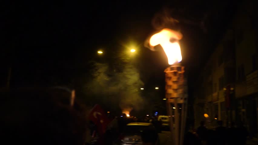 Celebrations of the 100th anniversary of the Republic of Türkiye. 29 October 2023. Young man walking with a torch.