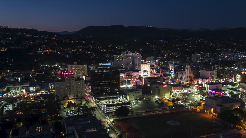 Establishing Aerial View Shot of Los Angeles LA CA, L.A. California USA, at night evening, super clear image, Hollywood, Walk of Fame, Hollywood City, Hollywood Boulevard, TCL Chinese Theatre track in