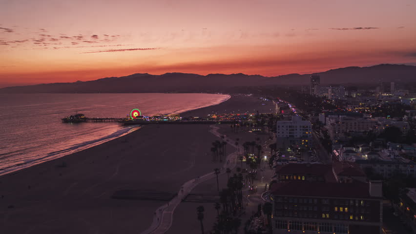 Establishing Aerial View Shot of Los Angeles LA CA, L.A. California USA, sunset sunrise colours, Santa Monica Pier Beach Royalty-Free Stock Footage #1110569755