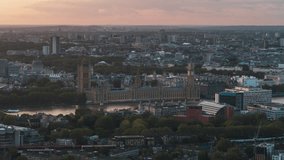 Establishing Aerial View Shot of London UK, United Kingdom, day, Westminster, circling left, overcast