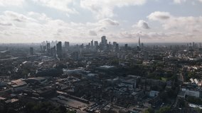 Aerial View Shot of London UK, United Kingdom, day, Square Mile, London Skyline, City of London, Shard, wide establishing, track back reveal