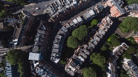 Aerial View Shot of London UK, United Kingdom, day, top down, overhead, heart of the City, day, sunny, Kensington, Chelsea, rich posh area, row of homes, Victorian houses