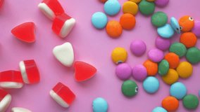 top view of colorful candy sweet jelly on pick background  - Powered by Shutterstock - Get 15% off with code: PIKWIZARD15