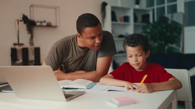 Father helping little son with school homework, cheering up sad kid, support - Powered by Shutterstock - Get 15% off with code: PIKWIZARD15