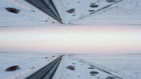 Aerial view of cars passing on road in winter landscape. Iceland. Abstract computer effect digital composed footage