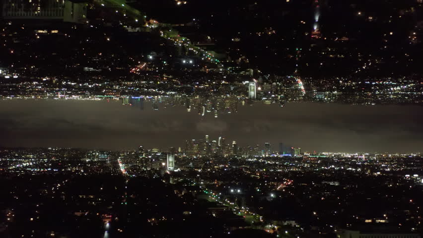 Aerial view of night cityscape with downtown skyscrapers. Hyperlapse shot of metropolis. Los Angeles, USA. Abstract computer effect digital composed footage