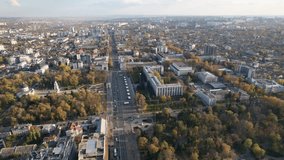 Panoramic aerial drone view of Triumphal Arch, Great National Assembly Square with Government Building with flag of Republic of Moldova on background in city center of Chisinau, Moldova. 4K video.