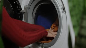 Hands putting dirty clothes into washing machine. Clothes cleaning, laundry service.  - Powered by Shutterstock - Get 15% off with code: PIKWIZARD15