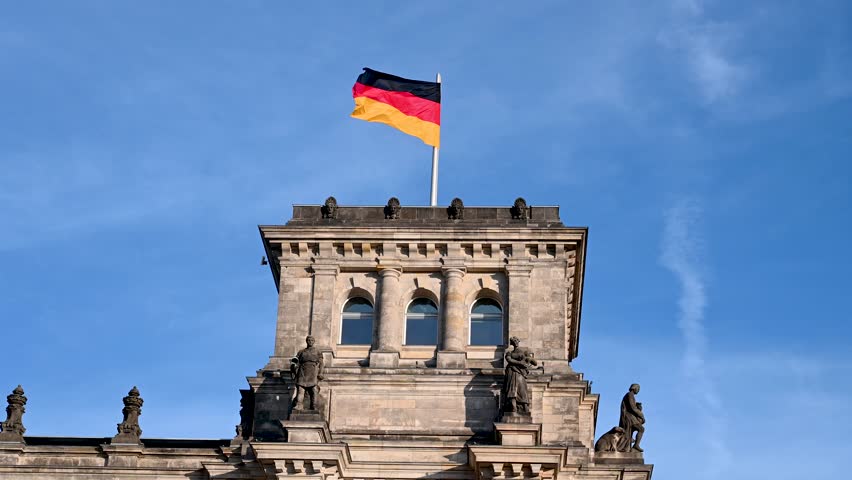 German Bundestag. Berlin, building of German Parliament. National flags flying on a flagpole in a front of Reichstag building in Berlin, Germany.  Royalty-Free Stock Footage #1110588965