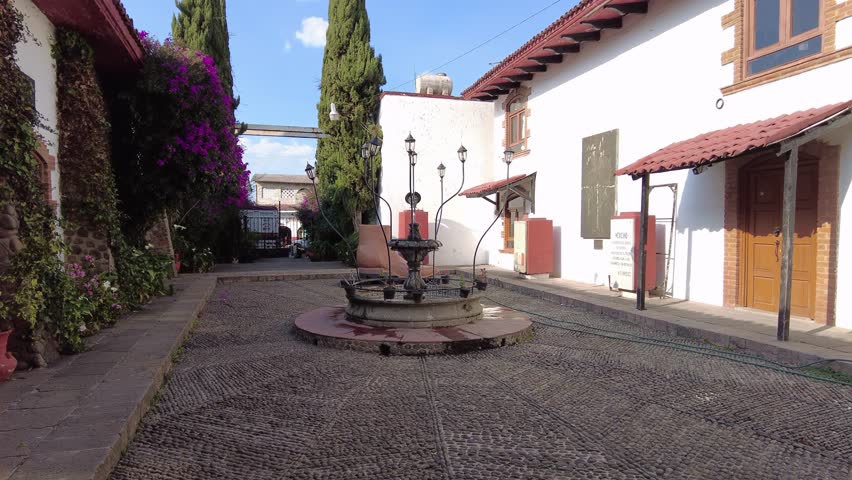 Beautiful waterfall in a quarry stone fountain with stone and border	
