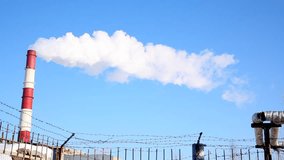 Video of pollution, smoke and steam discharged from a coal powered thermal power station.