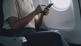 Traveling and technology. Flying at first class. Pretty young businees woman using smartphone while sitting in airplane.	 - Powered by Shutterstock - Get 15% off with code: PIKWIZARD15