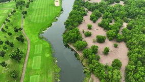 An abstract golf course, transformed into a colorful mosaic of shapes and patterns, where fairways and bunkers blend into a visually stunning masterpiece when viewed from a drone's artistic viewpoint.