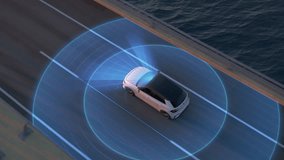 autonomous self-driving generic electric car driving along bridge or coastal highway into the sunset. Graphic animation of sensors scanning the road. Future transportation technology concept. Topview - Powered by Shutterstock - Get 15% off with code: PIKWIZARD15