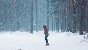 Happy young woman playing with border collie dog in snowy winter forest. Merry Christmas New year Day. Cheerful puppy jump to owner. Friendship of girl and pet. Having fun together. Dogs best friends. - Powered by Shutterstock - Get 15% off with code: PIKWIZARD15