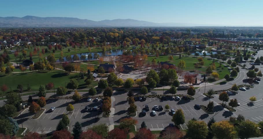 Aerial view of a public park with ponds and views of Boise, Idaho