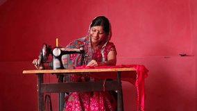 Indian rural woman using sewing machine at home - Powered by Shutterstock - Get 15% off with code: PIKWIZARD15