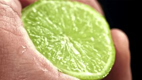 Splash of lime juice. Filmed on a high-speed camera at 1000 fps. High quality FullHD footage - Powered by Shutterstock - Get 15% off with code: PIKWIZARD15