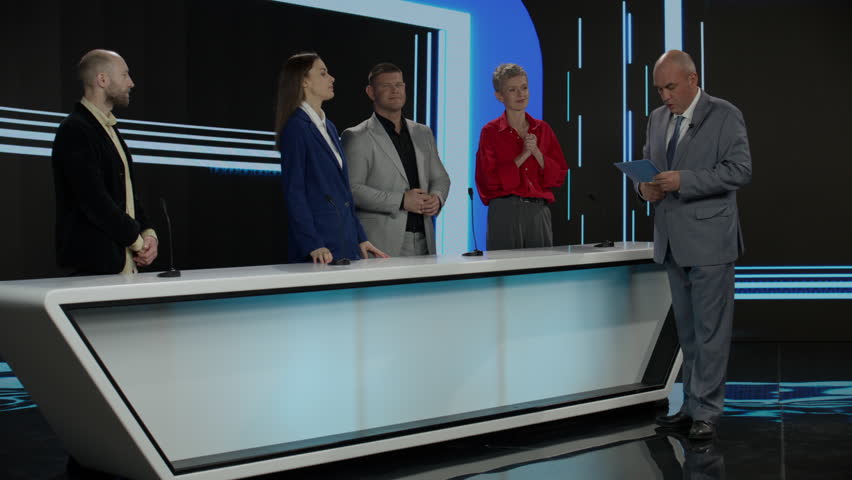 Funny charismatic host inviting the contestant to participate in final quiz round during recording of a fictional morning family game show