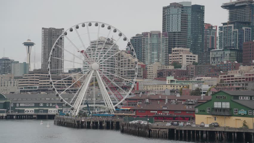 Seattle Washington Cityscape Skyline Skyscrapers Ferris Wheel and Pier View from The Sea Port Royalty-Free Stock Footage #1110620841