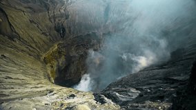 Video of the steaming active volcano crater of the Bromo on the Java island in Indonesia 